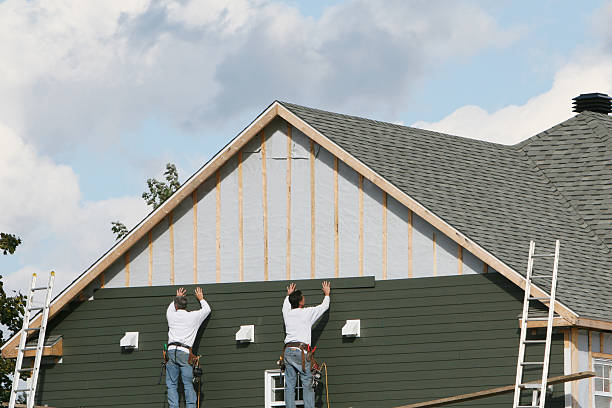 Professional Siding Replacement technician working in Finksburg, MD